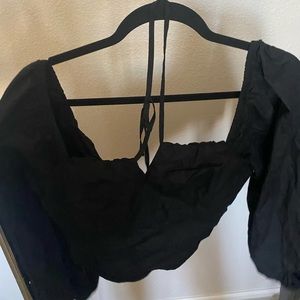 Black bubble shoulder top with zip up back